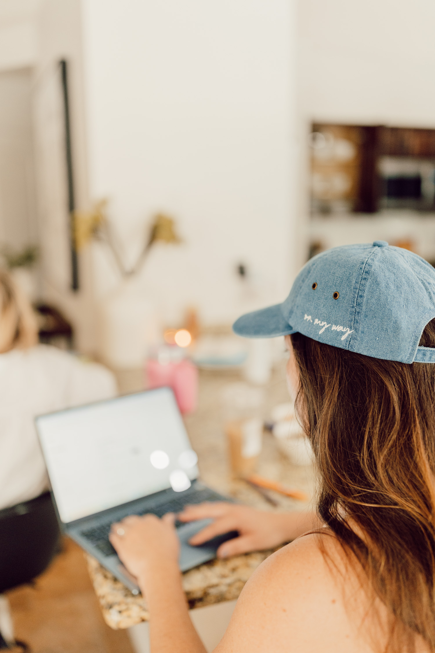 An entrepreneur working on her laptop, strategizing her next business pivot with confidence and purpose.